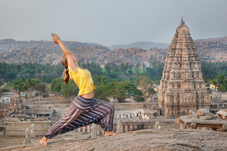 Pray - Doing Yoga in front of a temple 