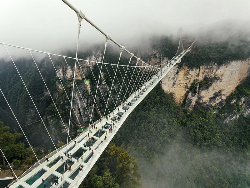 Aerial view of glass bridge at eco-travel destination Zhangjiajie, Hunan - the world's highest and longest glass Bridge. 