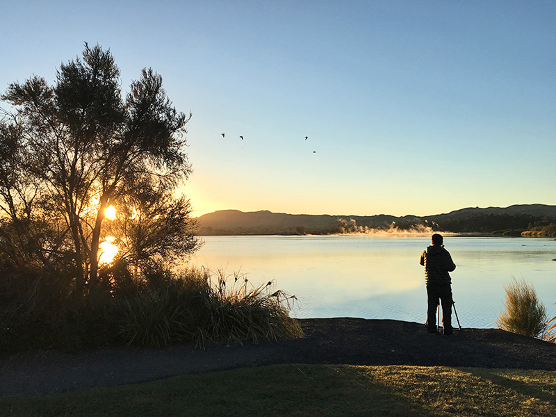 Eco-tourism at Lake Rotorua at sunrise - North island of New Zealand