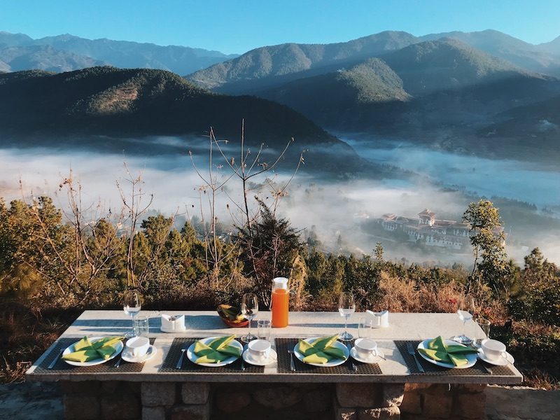 Nyilo breakfast in front of mountains in Dhumra Farm Resort, Bhutan