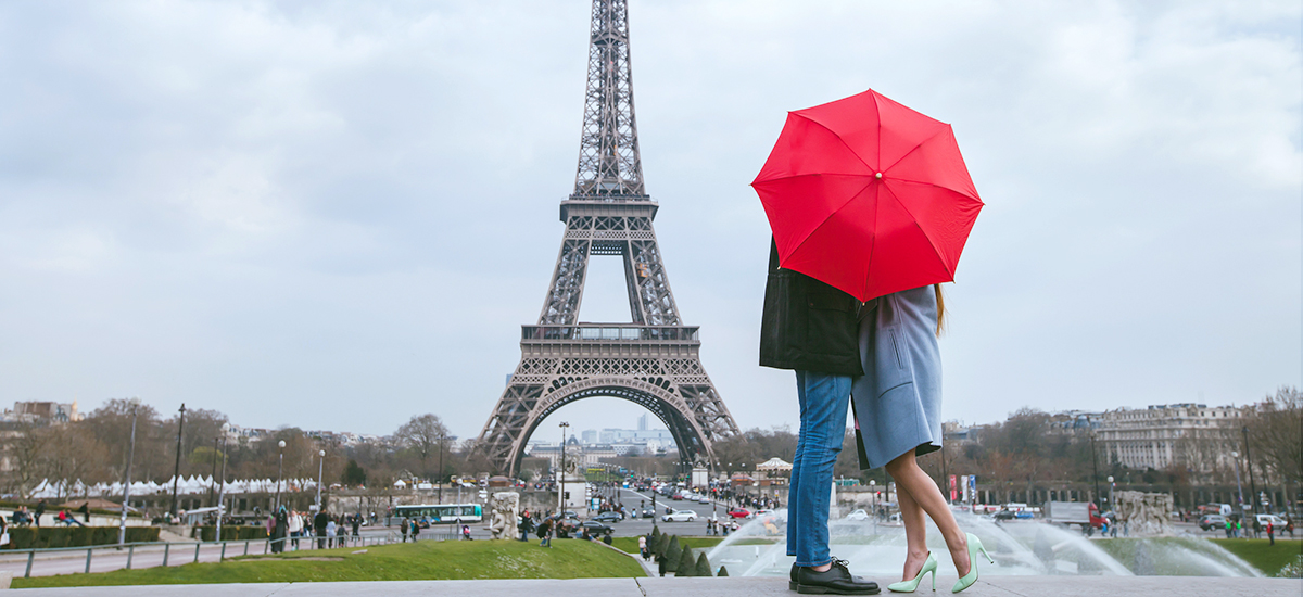 Romantic view of couple in front of Eiffel Tower, Paris